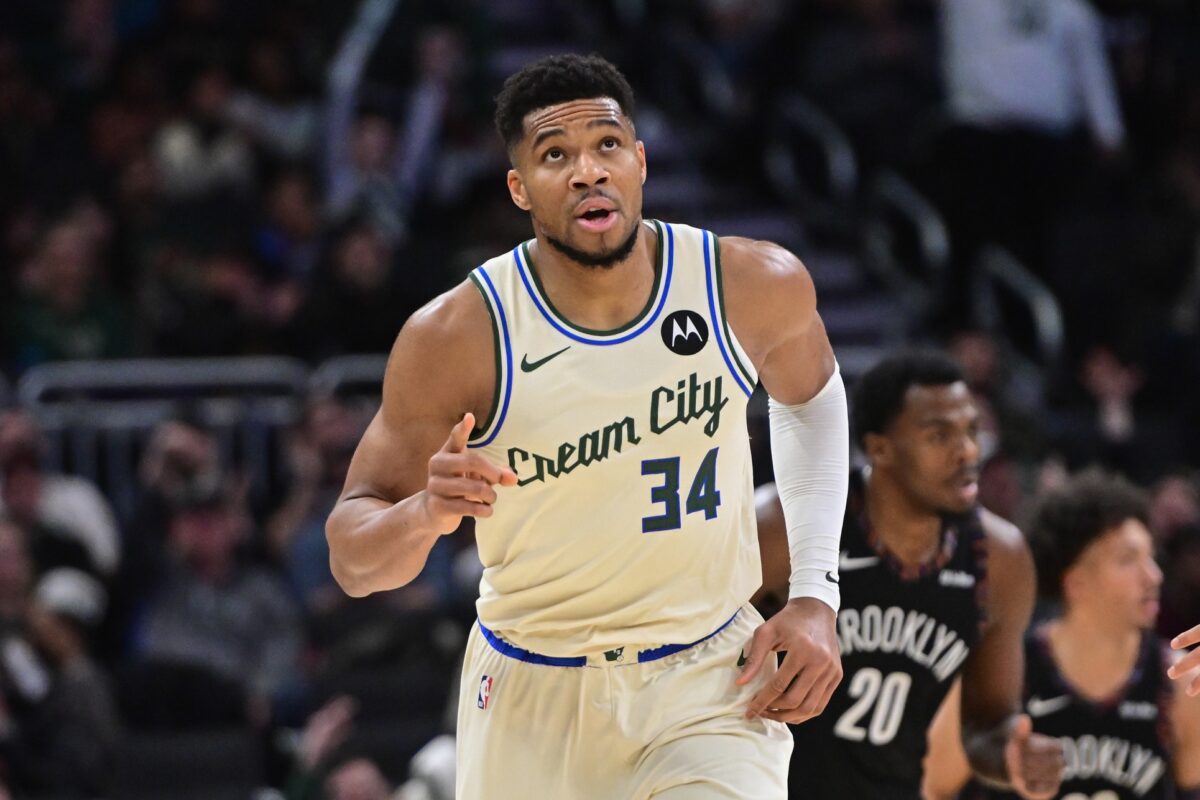 Milwaukee Bucks forward Giannis Antetokounmpo (34) reacts after scoring his 21,000th career point in the third quarter against the Brooklyn Nets at Fiserv Forum.