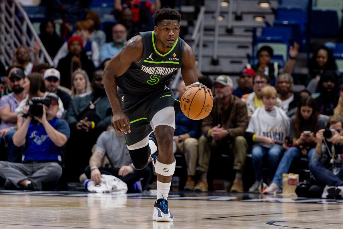 Minnesota Timberwolves guard Anthony Edwards (5) brings the ball up court against the New Orleans Pelicans during the second half at Smoothie King Center.