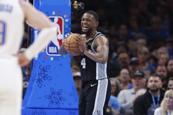 San Antonio Spurs guard De'Aaron Fox (4) celebrates after a play against the Oklahoma City Thunder during the second half at Paycom Center.