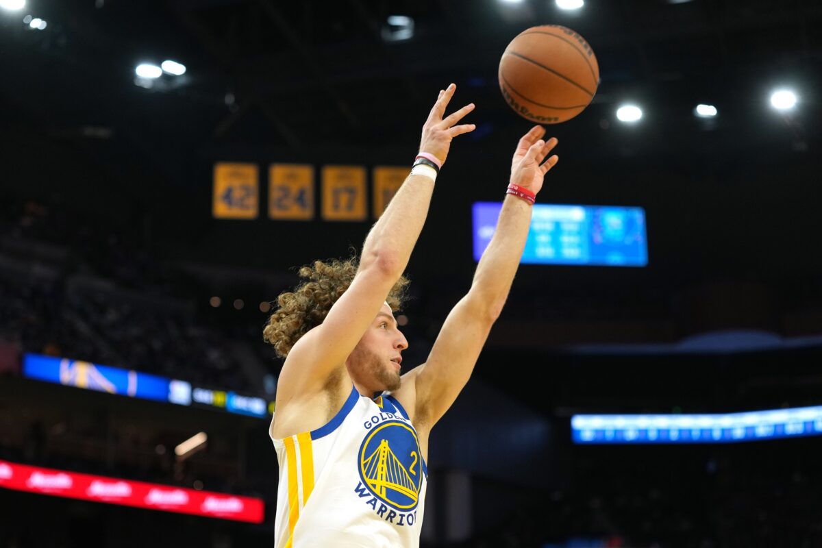 Golden State Warriors guard Brandin Podziemski (2) shoots against the Dallas Mavericks during the third quarter at Chase Center.