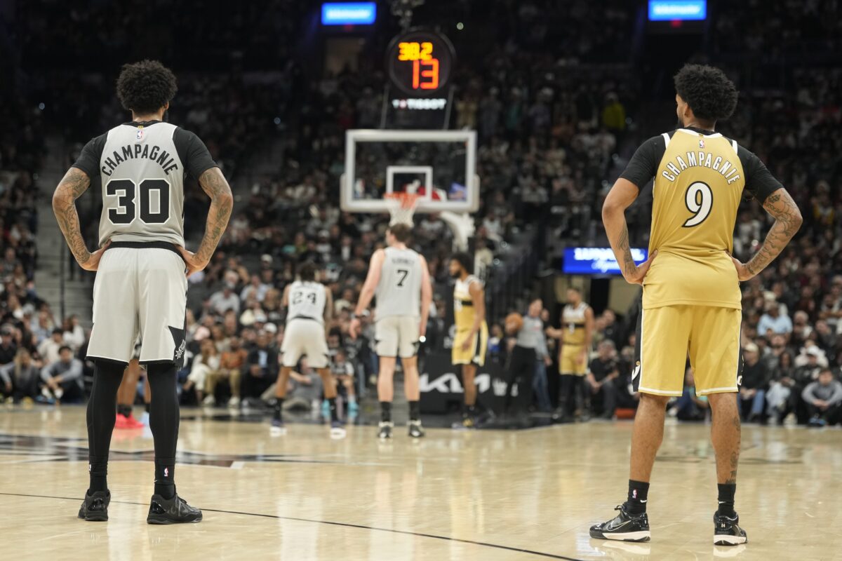 Identical twin brothers Washington Wizards forward Justin Champagnie (9) and San Antonio Spurs forward Julian Champagnie (30) during the second half at Frost Bank Center.