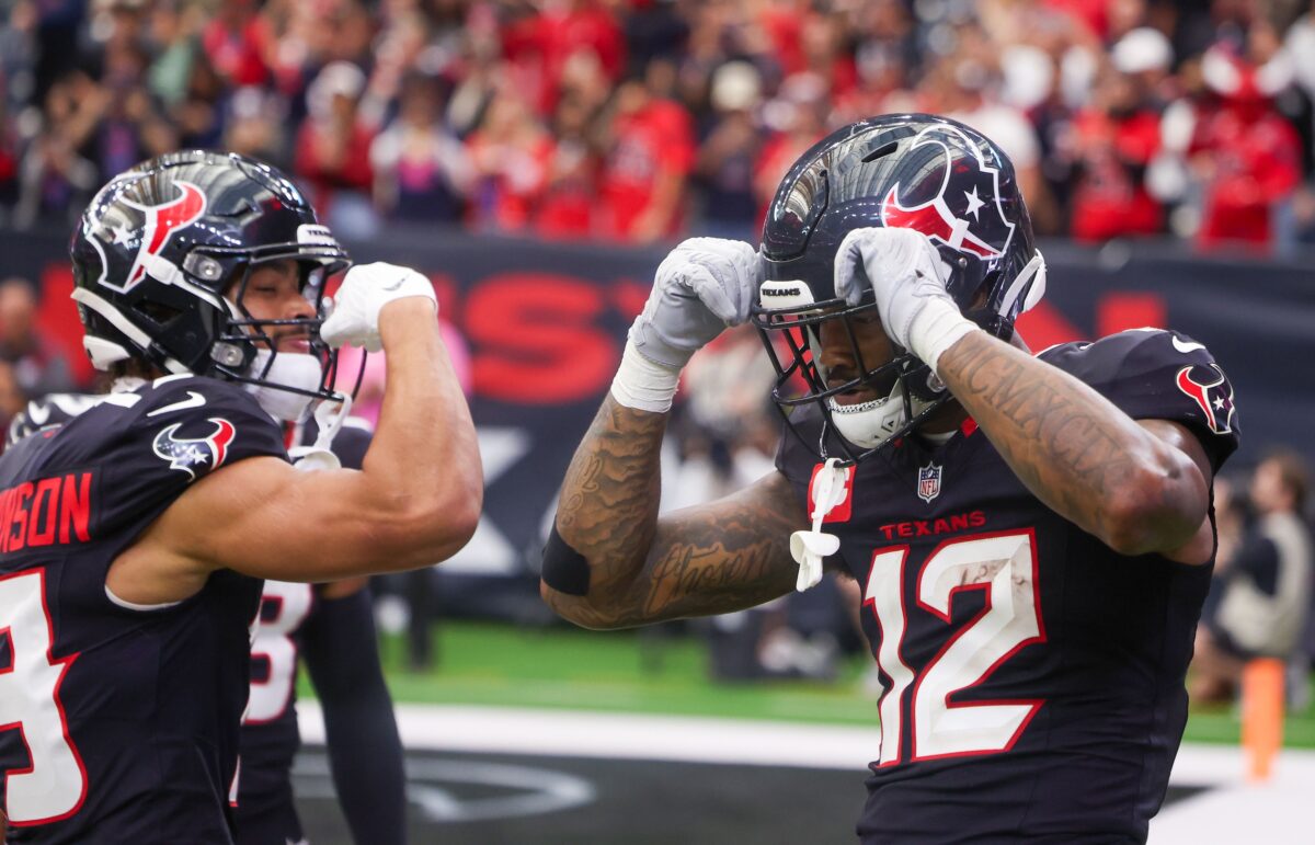 Houston Texans wide receiver Xavier Hutchinson (19) celebrates wide receiver Nico Collins (12) touchdown against the Arizona Cardinals in the fourth quarter at NRG Stadium.