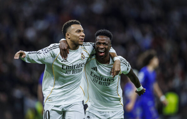 Kylian Mbappe of Real Madrid CF (L) celebrates his goal with Vinicius Junior of Real Madrid CF (R) during the UEFA Champions League match between Real Madrid CF and AS Monaco FC at Santiago Bernabeu Stadium on January 20, 2026 in Madrid, Spain.