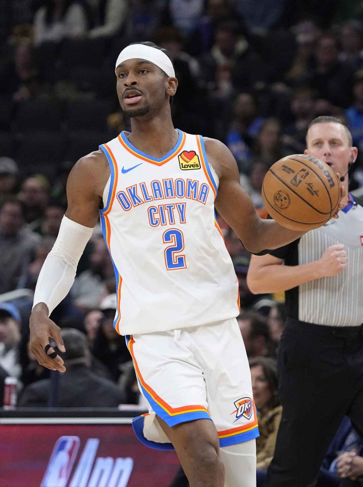 Oklahoma City Thunder guard Shai Gilgeous-Alexander (2) brings the ball up the court against the Milwaukee Bucks in the first half at Fiserv Forum.
