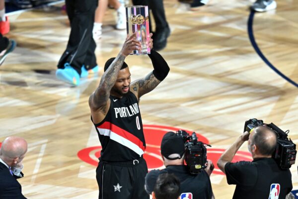 Portland Trail Blazers guard Damian Lillard (0) celebrates with the trophy after winning the three point contest during the 2026 NBA All Star Saturday Night at Intuit Dome.