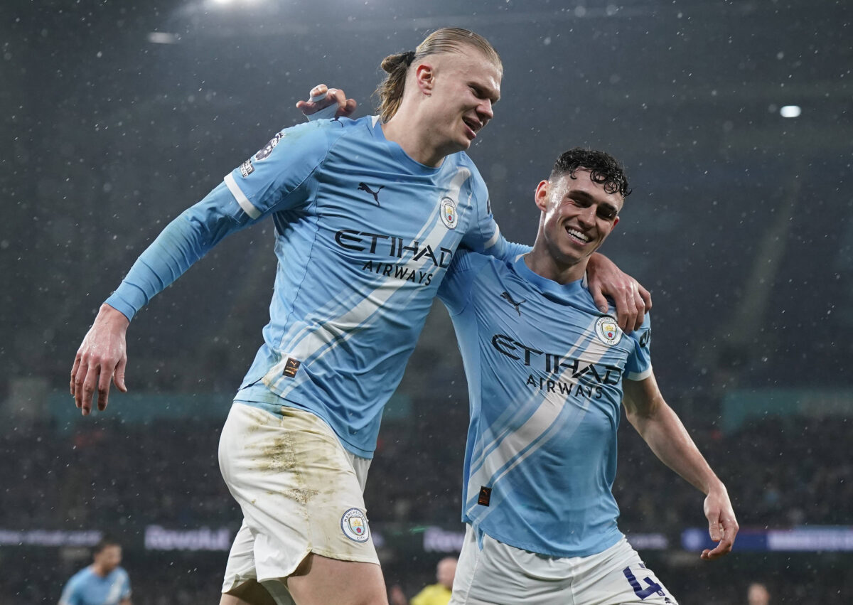 Erling Haaland of Manchester City celebrates after scoring the third goal with Phil Foden of Manchester City during the Manchester City vs Fulham Premier League match at the Etihad Stadium, Manchester.