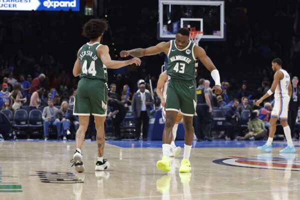 Milwaukee Bucks forward Thanasis Antetokounmpo (43) and Milwaukee Bucks guard Andre Jackson Jr. (44) celebrate after a play against the Oklahoma City Thunder during the second half at Paycom Center.