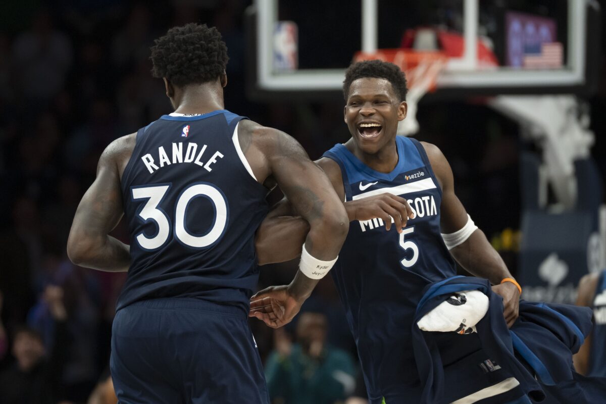 Minnesota Timberwolves forward Julius Randle (30) celebrates making a shot with guard Anthony Edwards (5) against the Portland Trail Blazers in the second half at Target Center.