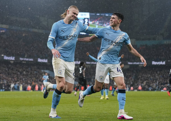 Erling Haaland of Manchester City celebrates after scoring the third goal with Phil Foden of Manchester City during the Manchester City vs Fulham Premier League match at the Etihad Stadium, Manchester.