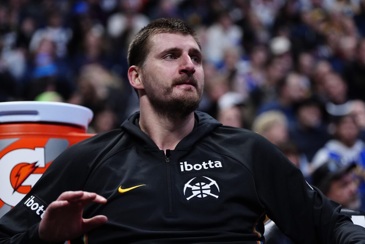 Denver Nuggets center Nikola Jokic (15) on the bench in the fourth quarter against the New York Knicks at Ball Arena.