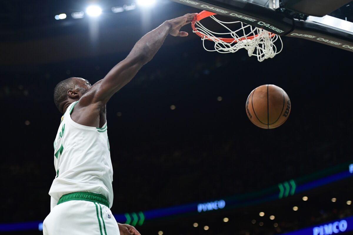 Boston Celtics guard Jaylen Brown (7) dunks the ball during the second half against the Brooklyn Nets at TD Garden.