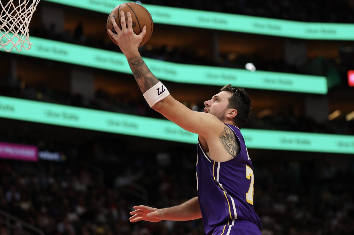 Los Angeles Lakers guard Luka Doncic (77) drives to the basket against the Houston Rockets in the second half at Toyota Center.