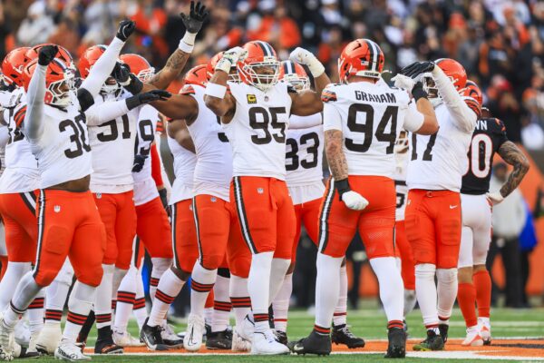 Cleveland Browns defensive end Myles Garrett (95) celebrates with teammates following a sack against the Cincinnati Bengals during the fourth quarter at Paycor Stadium. The play set a new NFL single season sack record by Garrett.