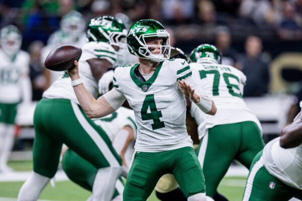 New York Jets quarterback Brady Cook (4) passes against the New Orleans Saints during the second half at Caesars Superdome.