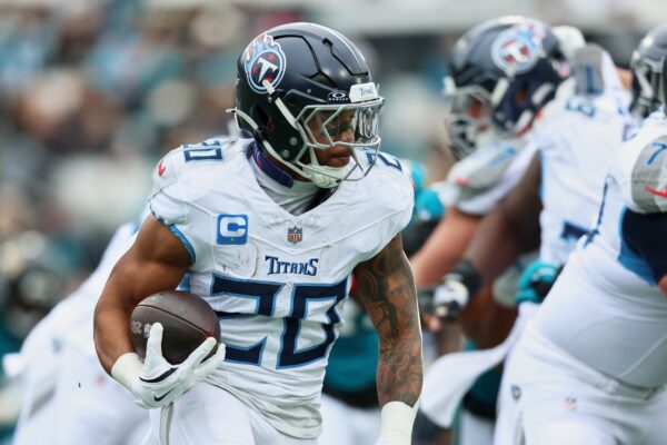 Tennessee Titans running back Tony Pollard (20) runs the ball against the Jacksonville Jaguars during the first quarter at EverBank Stadium.
