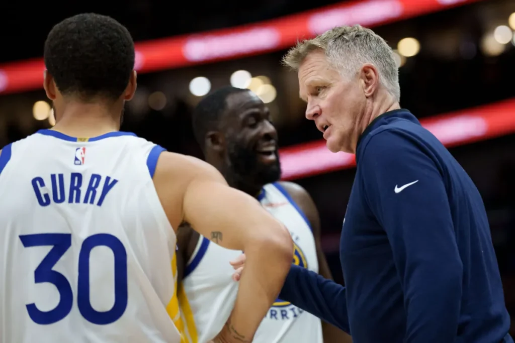 Steve Kerr a colloquio con Steph Curry