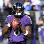 BALTIMORE, MARYLAND - DECEMBER 04: Lamar Jackson #8 of the Baltimore Ravens warms up before the game against the Denver Broncos at M&T Bank Stadium on December 04, 2022 in Baltimore, Maryland.