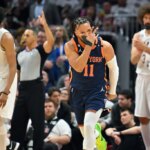 CLEVELAND, OHIO - APRIL 15: Jalen Brunson #11 of the New York Knicks celebrates after scoring during the fourth quarter of Game One of the Eastern Conference First Round Playoffs against the Cleveland Cavaliers at Rocket Mortgage Fieldhouse on April 15, 2023 in Cleveland, Ohio. The Knicks defeated the Cavaliers 101-97.