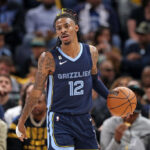 MEMPHIS, TENNESSEE - APRIL 16: Ja Morant #12 of the Memphis Grizzlies brings the ball up court during the game against the Los Angeles Lakers during Game One of the Western Conference First Round Playoffs at FedExForum on April 16, 2023 in Memphis, Tennessee.