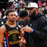 HOUSTON, TEXAS - MARCH 28: Bronny James #6 of the West team talks to Lebron James of the Los Angeles Lakers after the 2023 McDonald's High School Boys All-American Game at Toyota Center on March 28, 2023 in Houston, Texas.