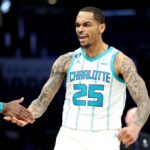 CHARLOTTE, NORTH CAROLINA - FEBRUARY 13: P.J. Washington #25 of the Charlotte Hornets celebrates after making a three pointer during the fourth period of a basketball game against the Atlanta Hawks at Spectrum Center on February 13, 2023 in Charlotte, North Carolina.