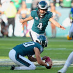 PHILADELPHIA, PA - OCTOBER 01: Philadelphia Eagles place kicker Jake Elliott (4) kicks an overtime field goal for the win during the game between the Philadelphia Eagles and the Washington Commanders on October 1, 2023, at Lincoln Financial Field