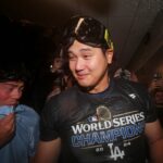 Oct 31, 2024; New York, New York, USA; Los Angeles Dodgers two-way player Shohei Ohtani (17) celebrates in the locker room after the Los Angeles Dodgers beat the New York Yankees in game four to win the 2024 MLB World Series at Yankee Stadium.
