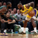 BOSTON, MASSACHUSETTS - JANUARY 28: Jaylen Brown #7 of the Boston Celtics defends LeBron James #6 of the Los Angeles Lakers during the first half at TD Garden on January 28, 2023 in Boston, Massachusetts.