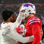 ORCHARD PARK, NEW YORK - DECEMBER 17: Tua Tagovailoa #1 of the Miami Dolphins and Josh Allen #17 of the Buffalo Bills meet on the field after their game at Highmark Stadium on December 17, 2022 in Orchard Park, New York