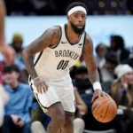 WASHINGTON, DC - DECEMBER 29: Royce O'Neale #00 of the Brooklyn Nets dribbles the ball during the second half against the Washington Wizards at Capital One Arena on December 29, 2023 in Washington, DC.