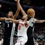 SAN ANTONIO, TX - MARCH 29: Jalen Brunson #11 of the New York Knicks drives on Victor Wembanyama #1 of the San Antonio Spurs during the second half at Frost Bank Center on March 29, 2024 in San Antonio, Texas.