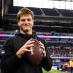 INDIANAPOLIS, INDIANA - MARCH 2: Drake Maye #QB04 of North Carolina holds a football during the NFL Scouting Combine at Lucas Oil Stadium on March 2, 2024 in Indianapolis, Indiana