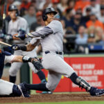HOUSTON, TEXAS - MARCH 28: Juan Soto #22 of the New York Yankees hits an RBI single in the fifth inning against the Houston Astros on Opening Day at Minute Maid Park on March 28, 2024 in Houston, Texas.