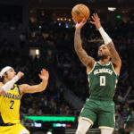 MILWAUKEE, WISCONSIN - APRIL 21: Damian Lillard #0 of the Milwaukee Bucks shoots over Andrew Nembhard #2 of the Indiana Pacers during the second half of game one of the Eastern Conference First Round Playoffs at Fiserv Forum on April 21, 2024 in Milwaukee, Wisconsin.
