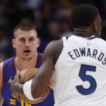 DENVER, COLORADO - MAY 04: Nikola Jokic #15 of the Denver Nuggets guards Anthony Edwards #5 of the Minnesota Timberwolves in the first quarter during Game One of the Western Conference Second Round Playoffs at Ball Arena on May 04, 2024 in Denver, Colorado.