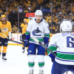 NASHVILLE, TN - MAY 03: Vancouver Canucks center Pius Suter (24) celebrates his game winning goal during Game Six of the First Round of the Stanley Cup Playoffs between the Nashville Predators and Vancouver Canucks, held on May 3, 2024, at Bridgestone Arena in Nashville, Tennessee.
