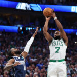DALLAS, TEXAS - JUNE 12: Jaylen Brown #7 of the Boston Celtics attempts a shot while being guarded by Tim Hardaway Jr. #10 of the Dallas Mavericks in the fourth quarter in Game Three of the 2024 NBA Finals at American Airlines Center on June 12, 2024 in Dallas, Texas.