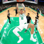 BOSTON, MASSACHUSETTS - JUNE 06: Kristaps Porzingis #8 of the Boston Celtics dunks the ball during the first quarter against the Dallas Mavericks in Game One of the 2024 NBA Finals at TD Garden on June 06, 2024 in Boston, Massachusetts.