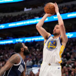 DALLAS, TEXAS - APRIL 05: Klay Thompson #11 of the Golden State Warriors shoots the ball against Kyrie Irving #11 of the Dallas Mavericks during the second half at American Airlines Center on April 05, 2024 in Dallas, Texas. NOTE TO USER: User expressly acknowledges and agrees that, by downloading and or using this photograph, User is consenting to the terms and conditions of the Getty Images License Agreement.
