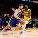 Los Angeles, CA - May 12: Klay Thompson #11 of the Golden State Warriors drives to the basket against LeBron James #6 of the Los Angeles Lakers in the first half of game 6 of a Western Conference Semifinals NBA playoff basketball game at the Crypto.com Arena in Los Angeles on Friday, May 12, 2023.