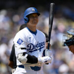 Shohei Ohtani #17 of the Los Angeles Dodgers gets ready to bat in the first inning against the Tampa Bay Rays during a MLB baseball game at Dodger Stadium in LOS ANGELES, CA - AUGUST 25