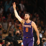 Nov 10, 2021; Phoenix, Arizona, USA; Phoenix Suns forward Frank Kaminsky (8) celebrates a shot against the Portland Trail Blazers in the second half at Footprint Center.