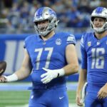 Detroit Lions quarterback Jared Goff (16) and center Frank Ragnow (77) warm up before action against the Atlanta Falcons at Ford Field, Sunday, Sept. 24, 2023.
