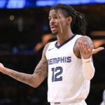 Jan 5, 2024; Los Angeles, California, USA; Memphis Grizzlies guard Ja Morant (12) reacts in the second half against the Los Angeles Lakers at Crypto.com Arena.