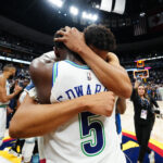 May 19, 2024; Denver, Colorado, USA; Minnesota Timberwolves center Karl-Anthony Towns (32) and guard Anthony Edwards (5) celebrate defeating the Denver Nuggets in game seven of the second round for the 2024 NBA playoffs at Ball Arena.