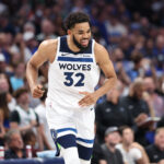 May 28, 2024; Dallas, Texas, USA; Minnesota Timberwolves center Karl-Anthony Towns (32) reacts against the Dallas Mavericks during the fourth quarter of game four of the western conference finals for the 2024 NBA playoffs at American Airlines Center.