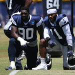 Jul 30, 2024; Oxnard, CA, USA; Dallas Cowboys defensive end DeMarcus Lawrence (90) and linebacker Micah Parsons (11) during training camp at the River Ridge Playing Fields in Oxnard, California.