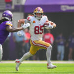 Sep 15, 2024; Minneapolis, Minnesota, USA; San Francisco 49ers tight end George Kittle (85) runs after the catch against the Minnesota Vikings in the second quarter at U.S. Bank Stadium. Mandatory Credit: Brad Rempel-Imagn Images