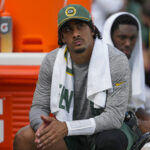 Sep 15, 2024; Green Bay, Wisconsin, USA; Green Bay Packers quarterback Jordan Love looks on from the sidelines during the fourth quarter against the Indianapolis Colts at Lambeau Field.