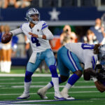Sep 22, 2024; Arlington, Texas, USA; Dallas Cowboys quarterback Dak Prescott (4) drops back to pass during the fourth quarter against the Baltimore Ravens at AT&T Stadium. Mandatory Credit: Andrew Dieb-Imagn Images